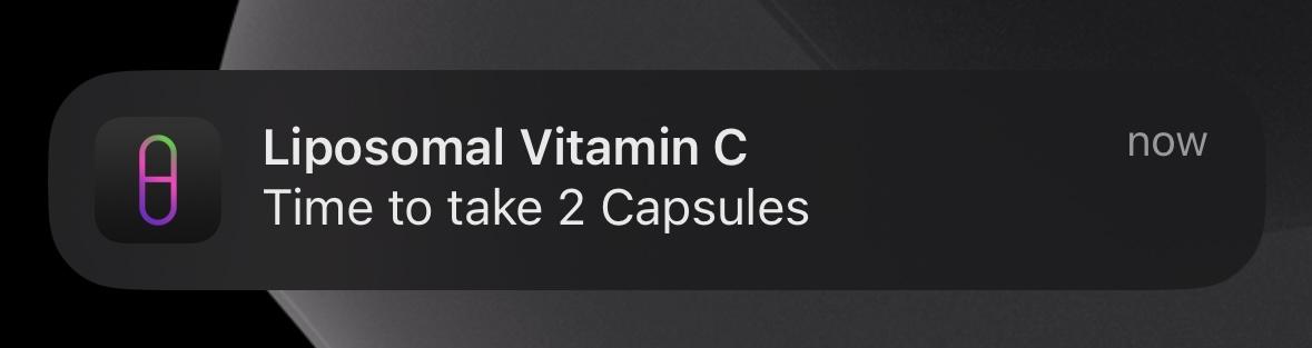 An iPhone notification from SuppTrack reading Liposomal Vitamin C, time to take 2 capsules